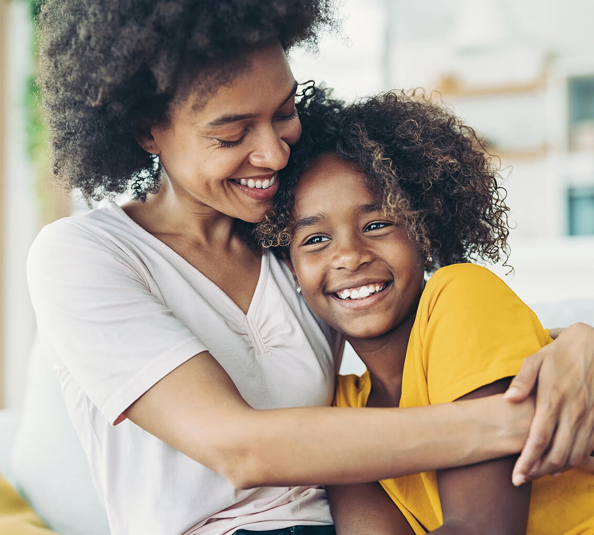 Woman hugging her daughter.
