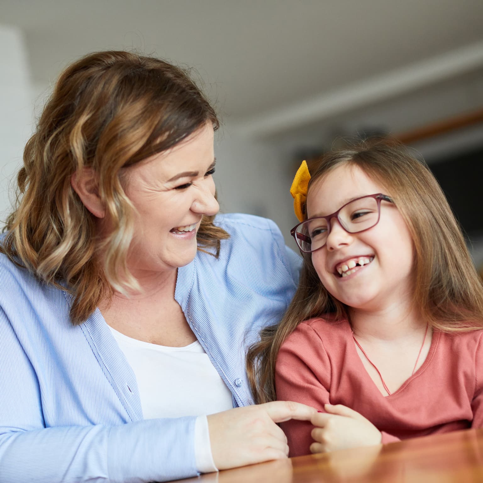 Mother and daughter laughing